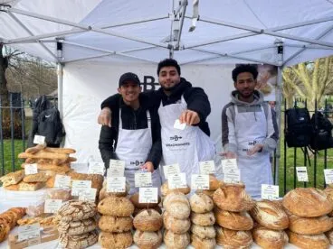 Social enterprise Breadwinners selling bread at a market stand